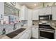 Kitchen corner with granite countertop and sink at 2486 Five Forks Trl, The Villages, FL 32162
