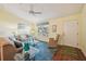 Living room featuring hardwood floors and comfortable seating at 2486 Five Forks Trl, The Villages, FL 32162