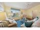 Spacious living room with hardwood floors and ample natural light at 2486 Five Forks Trl, The Villages, FL 32162