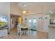 Casual dining area with white table and chairs, near sliding doors at 26637 Bermuda Dr, Tavares, FL 32778