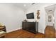 Home bar with dark wood cabinet and TV at 2746 Se 19Th Ct, Ocala, FL 34471