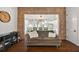 Charming dining area with brick accent wall and wood table at 2746 Se 19Th Ct, Ocala, FL 34471
