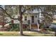 Charming front porch with brick accents, inviting entry and beautiful landscaping at 2746 Se 19Th Ct, Ocala, FL 34471