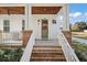 Inviting front porch with brick steps and a wooden ceiling at 2746 Se 19Th Ct, Ocala, FL 34471