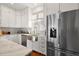 Modern kitchen features stainless steel appliances and farmhouse sink at 2746 Se 19Th Ct, Ocala, FL 34471