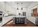 Spacious kitchen with white cabinets, stainless steel appliances, and a large island at 2746 Se 19Th Ct, Ocala, FL 34471