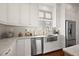 Modern kitchen features stainless steel appliances and farmhouse sink at 2746 Se 19Th Ct, Ocala, FL 34471