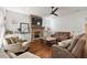 Spacious living room with brick fireplace and hardwood floors at 2746 Se 19Th Ct, Ocala, FL 34471