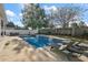 Refreshing pool with waterfall feature and lounge chairs at 2746 Se 19Th Ct, Ocala, FL 34471
