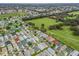 An aerial perspective showcasing a large residential area with homes and green spaces at 2806 Salamanca St, The Villages, FL 32162