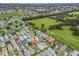 Aerial view of a residential community showcasing numerous homes and lush green areas at 2806 Salamanca St, The Villages, FL 32162