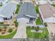 Single-story home with a two-car garage, nicely landscaped yard, and white picket fence at 2806 Salamanca St, The Villages, FL 32162