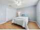Well-lit bedroom with a queen-size bed and wood flooring at 2806 Salamanca St, The Villages, FL 32162
