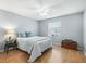 Cozy bedroom with a queen-size bed and wood flooring at 2806 Salamanca St, The Villages, FL 32162
