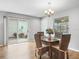 Dining room with sliding glass doors leading to a patio and seating for four at 2806 Salamanca St, The Villages, FL 32162