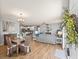 Bright dining area with hardwood floors and view into living room at 2806 Salamanca St, The Villages, FL 32162