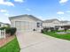 Single story home with a two-car garage and nicely landscaped yard at 2806 Salamanca St, The Villages, FL 32162