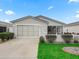 Single story home with a two-car garage and nicely landscaped yard at 2806 Salamanca St, The Villages, FL 32162