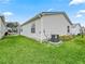 House exterior with a well-maintained lawn and AC unit at 2806 Salamanca St, The Villages, FL 32162