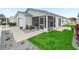 Relaxing screened porch with a ceiling fan and access to the backyard at 2806 Salamanca St, The Villages, FL 32162