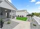 Cozy screened porch with a bench, ceiling fan, and view of the backyard at 2806 Salamanca St, The Villages, FL 32162