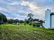 Large backyard with a patio and partial view of the house at 3180 Sixma Rd, Lake Helen, FL 32744