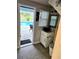 Bathroom with modern vanity and pool access at 3180 Sixma Rd, Lake Helen, FL 32744