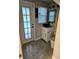 Clean bathroom with tile floors and a door to outside at 3180 Sixma Rd, Lake Helen, FL 32744