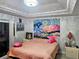 Bedroom with vibrant wall hanging and comfortable bed at 3180 Sixma Rd, Lake Helen, FL 32744