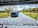 Long paved driveway leading to a home at 3180 Sixma Rd, Lake Helen, FL 32744
