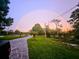 Paved driveway with a rainbow visible in the background at 3180 Sixma Rd, Lake Helen, FL 32744