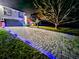 Paved driveway with lights leading to a house at night at 3180 Sixma Rd, Lake Helen, FL 32744