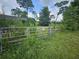 Metal gate entrance to property at 3180 Sixma Rd, Lake Helen, FL 32744