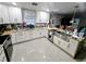 Spacious kitchen featuring white cabinets and granite countertops at 3180 Sixma Rd, Lake Helen, FL 32744