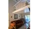 Living room with loft and view of the pool at 3180 Sixma Rd, Lake Helen, FL 32744
