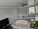 Spacious loft area with a comfortable couch and a view of the entryway at 3180 Sixma Rd, Lake Helen, FL 32744