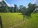Vacant lot partially bordered by a wooden fence at 3180 Sixma Rd, Lake Helen, FL 32744