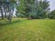 Grass lot with trees and partially fenced at 3180 Sixma Rd, Lake Helen, FL 32744