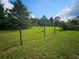 Vacant lot with grassy field and wooden fence at 3180 Sixma Rd, Lake Helen, FL 32744