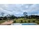 Relaxing pool area with a patio and lush landscaping at 3180 Sixma Rd, Lake Helen, FL 32744