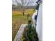 Landscaped yard with a paved walkway and trees at 3180 Sixma Rd, Lake Helen, FL 32744
