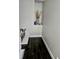 Modern staircase with dark hardwood floors at 3180 Sixma Rd, Lake Helen, FL 32744