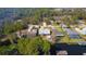 This waterfront home has canal access with a dock and an open yard surrounded by tall trees at 35534 Quail Run, Leesburg, FL 34788
