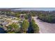 Overview of a residential area that features a mix of properties near a tranquil canal and open fields at 35534 Quail Run, Leesburg, FL 34788