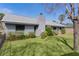 Charming home featuring a green lawn with a chimney and satellite dish at 35534 Quail Run, Leesburg, FL 34788