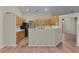 Charming kitchen featuring wood cabinets, a breakfast bar, and stainless steel appliances at 35534 Quail Run, Leesburg, FL 34788