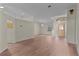 Open-plan living room with sleek flooring, light walls, and elegant lighting fixtures at 35534 Quail Run, Leesburg, FL 34788