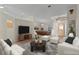 Bright living room featuring a pool table, modern furnishings and ample natural light at 35534 Quail Run, Leesburg, FL 34788