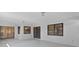 Open sunroom with sliding glass doors, ideal for indoor-outdoor living and relaxation at 35534 Quail Run, Leesburg, FL 34788