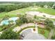 Aerial view of community pool, clubhouse, and golf course at 3610 Rollingbrook St, Clermont, FL 34711
